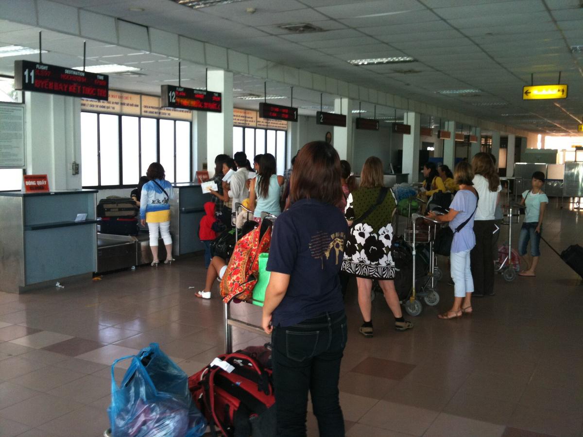 traveller using phone in airport